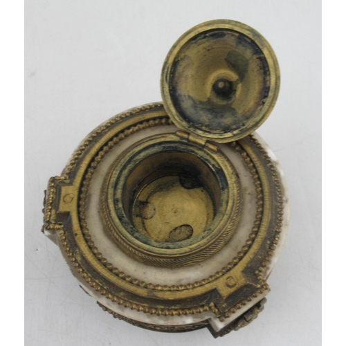 233 - A circular French ormalu and marble inkstand, with a decorated frieze of foliage and swags, raise do... 