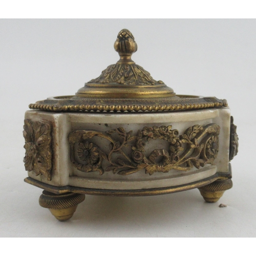 233 - A circular French ormalu and marble inkstand, with a decorated frieze of foliage and swags, raise do... 