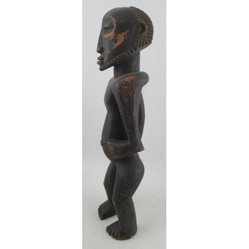 234 - An African tribal fertility figure, of a naked standing male, height 29ins