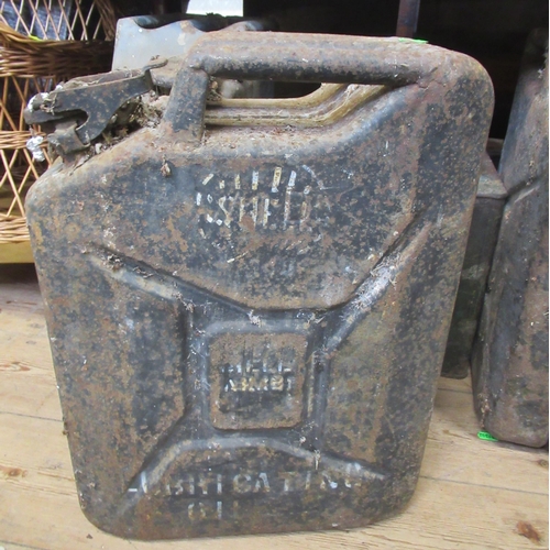 24 - A ESSO petrol can, with Pratts metal cap, together with four jerry cans