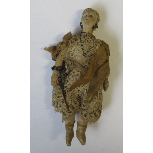 244 - A 19th century continental doll, possibly Maltese , with bead eyes and lace dress