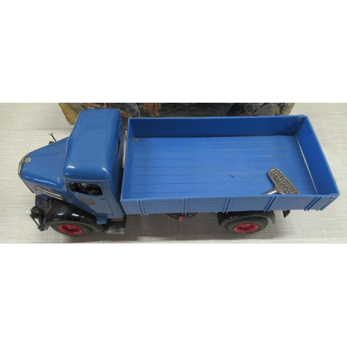 248 - A German Arnold Toys M.A.N. diesel clockwork tinplate and plastic tipper truck, 1950s, with key, ori... 