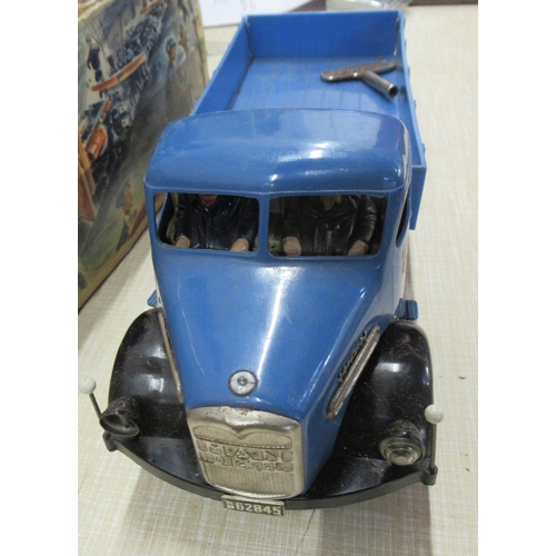 248 - A German Arnold Toys M.A.N. diesel clockwork tinplate and plastic tipper truck, 1950s, with key, ori... 