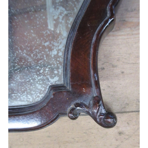 3 - A mahogany framed mirror, with carved detail