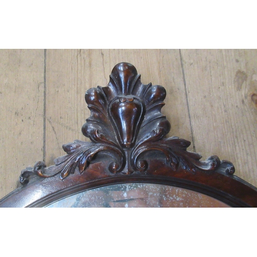 3 - A mahogany framed mirror, with carved detail