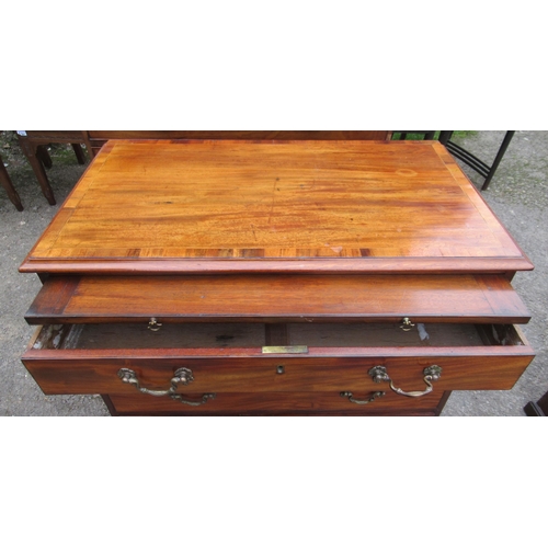 32 - A Georgian design mahogany chest, of four graduated long drawers below a brushing slide and cross ba... 