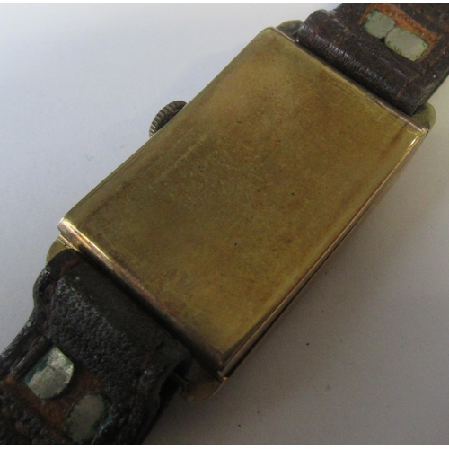 378 - A Vintage 9ct gold cased Gentleman's watch, with gold Arabic numerals to the rectangular dial, leath... 