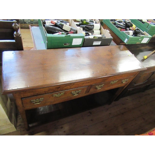 41 - An Antique oak dresser, with two frieze drawers, raised on tapering legs united by shelf below, widt... 