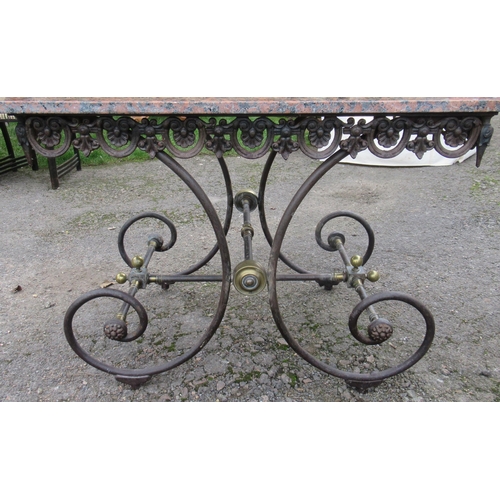 44 - A modern rectangular marble top table, raised on a scrolling metal base