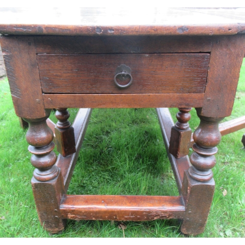 51 - An 18th century oak oval wake table, with double gate leg action, with turned legs and supports