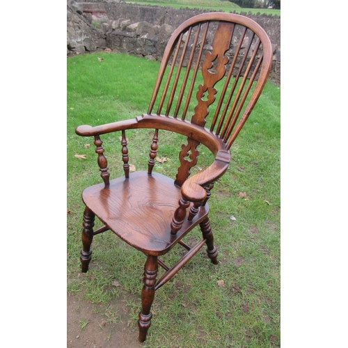 52 - A Harlequin set of 10 matched antique Windsor chairs, the high spindle back with a central christmas... 