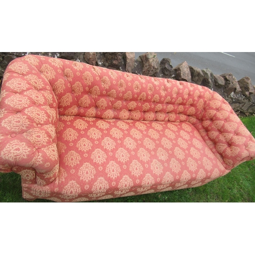 53 - A two seat roll top Chesterfield settee