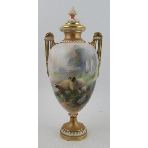 530 - A large two handled Royal Worcester covered vase, fully painted with sheep in a Highland landscape w... 