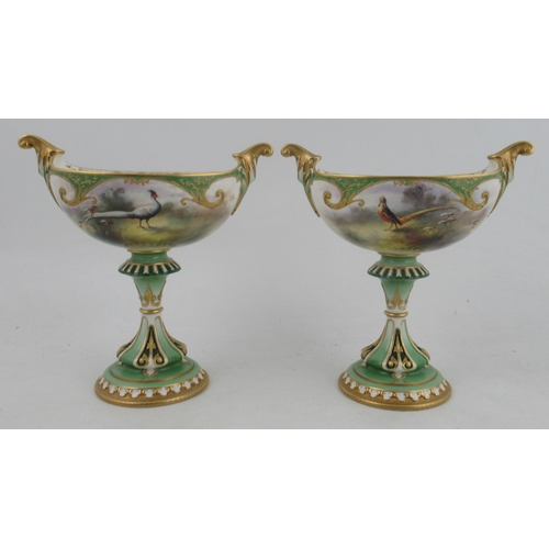 536 - A Royal Worcester Hadley's garniture, comprising a boat shaped centre piece, fully painted with phea... 