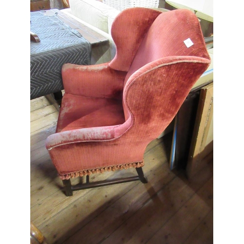 58 - An 18th century style wing arm chair with molded arms