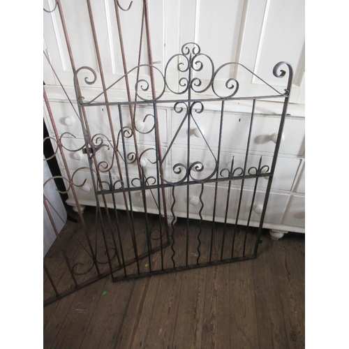 80 - An arched iron gate width 38ins, height approx 76ins, together with another width 35.5ins, height 50... 