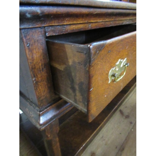 82 - A 19th century oak pot board dresser with open delft rack over two fitted cupboard drawers and two d... 