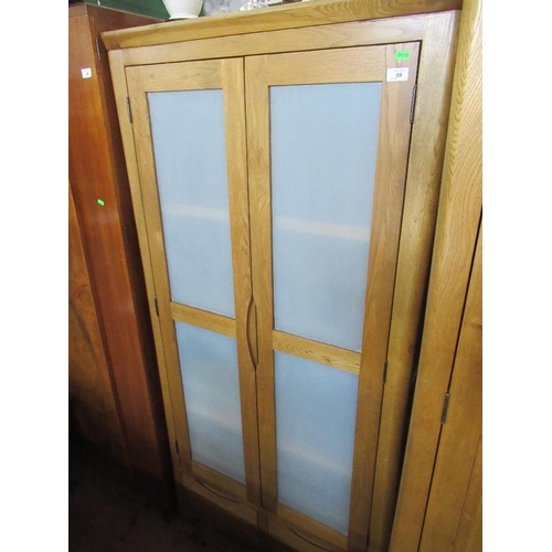 89 - A modern oak cupboard, width 39ins, depth 23ins, height 74ins