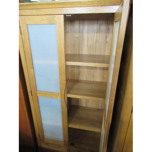 89 - A modern oak cupboard, width 39ins, depth 23ins, height 74ins