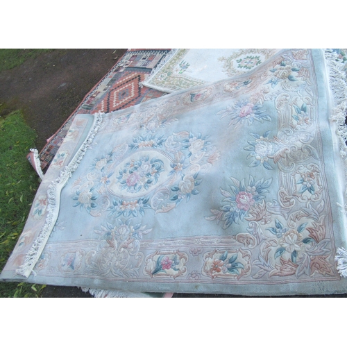 120 - A collection of rugs, including modern eastern examples, green ground, runners etc