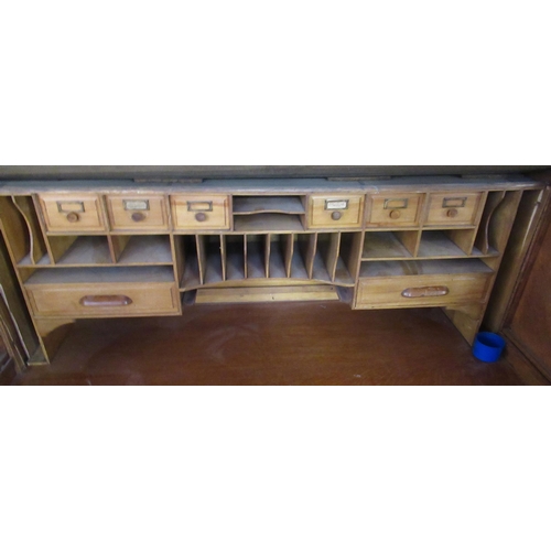 12 - An oak roll top desk, width 49ins, height 50ins, depth 32ins