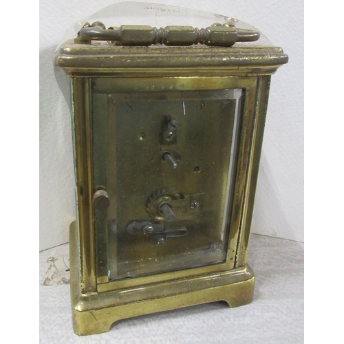 169 - A brass cased carriage clock