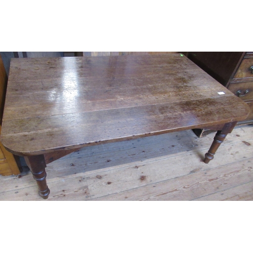 17 - A low 19th century oak gate leg table, 26ins x 49ins height 18ins