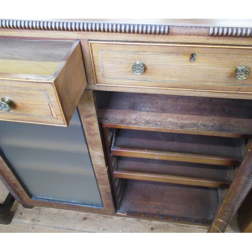 21 - A Regency mahogany Side Cabinet having beaded edge and similar vertical borders, fitted pair of cock... 