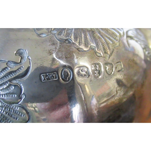 211 - A Georgian silver tea pot, with embossed body and flower finial, weight 23oz Declaration Submission ... 