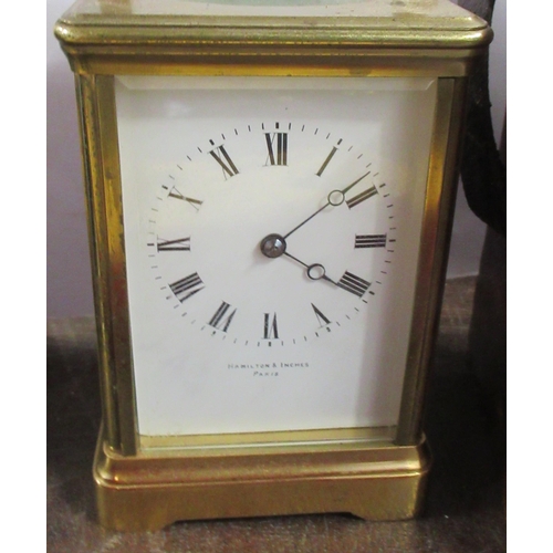 221 - A carriage clock, the enamel dial marked Hamilton & Inches Paris, together with leather covered trav... 