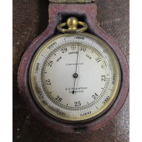 230 - W E Pain & Son, a brass cased pocket barometer, in leather covered case, together with a Cooke Londo... 