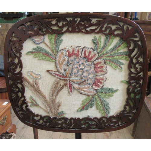 25 - A 19th century Regency rosewood pole screen, on tripartite base, with crewel work embroidered screen