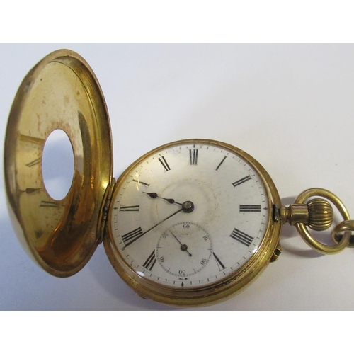 259 - An 18k gold half hunter pocket watch, together with an 18ct gold chain, with T bar, total weight 77.... 