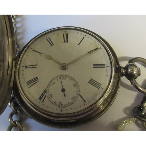 265 - A silver hunter pocket watch, with chain, together with a ladies silver cased open face pocket watch