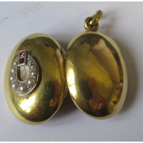 269 - A Victorian yellow metal locket, set with split pearls and rubies, together with a Niello work locke... 