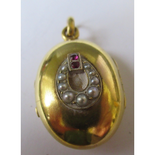 269 - A Victorian yellow metal locket, set with split pearls and rubies, together with a Niello work locke... 