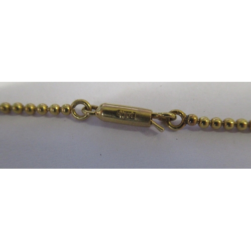 271 - A 15ct gold necklace, suspended with three filigree Maltese style crosses, weight 13.8g