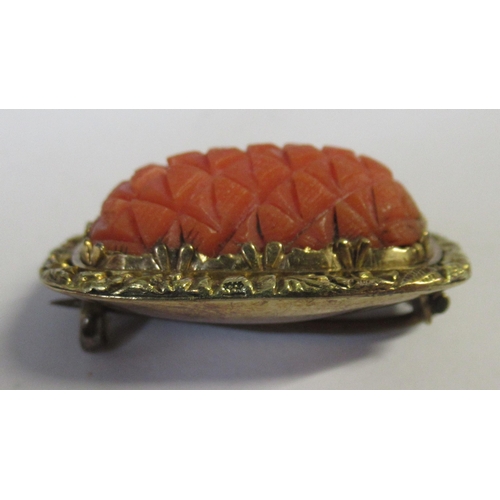 272 - A Victorian brooch, set with a carved coral, together with a cased pair of 9ct gold dress studs