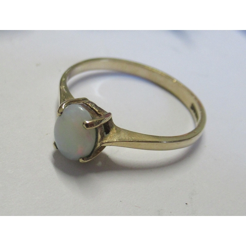 284 - A 9ct gold ring, set with an opal, weight 1.3g, together with a collection of bead necklaces etc