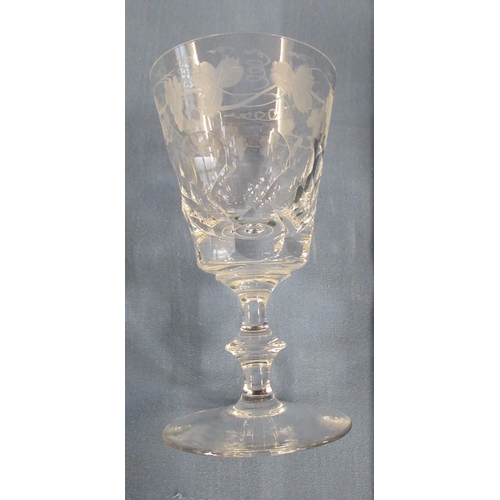 311 - A set of eight wine glasses, with etched vine pattern, together with two glass water carafes and bea... 