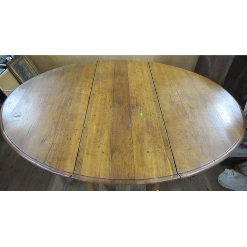 36 - An oak gateleg dining table, with oval top, 53ins x 67ins, height 29ins