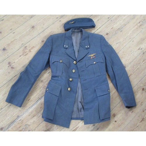 391 - A collection of Royal Dutch Air Force uniform, to include a long coat, overalls, flight suit and two... 