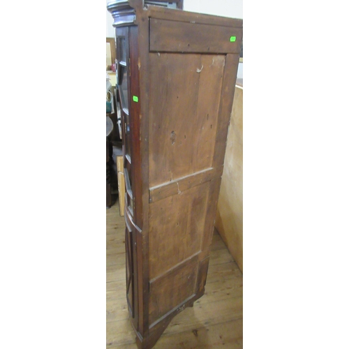 47A - A mahogany floor standing barrel fronted corner cabinet, with astragal glazed upper section and a pa... 