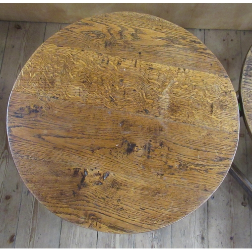 50 - A pair of 20th century oak circular tables, diameter 20.5ins, height 20.5ins