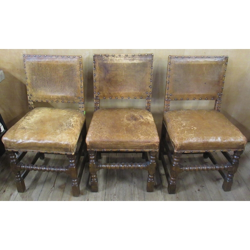 59 - A set of eight (6+2) oak and leather upholstered dining chairs, with turned front lower rail