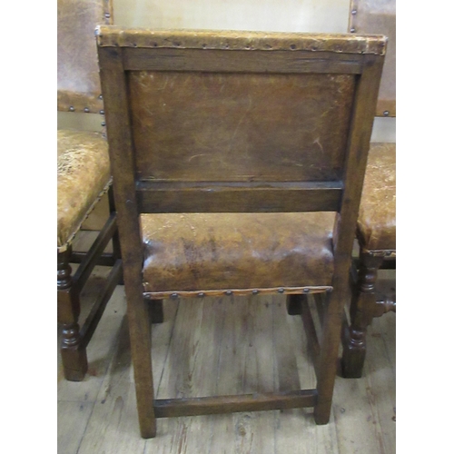 59 - A set of eight (6+2) oak and leather upholstered dining chairs, with turned front lower rail