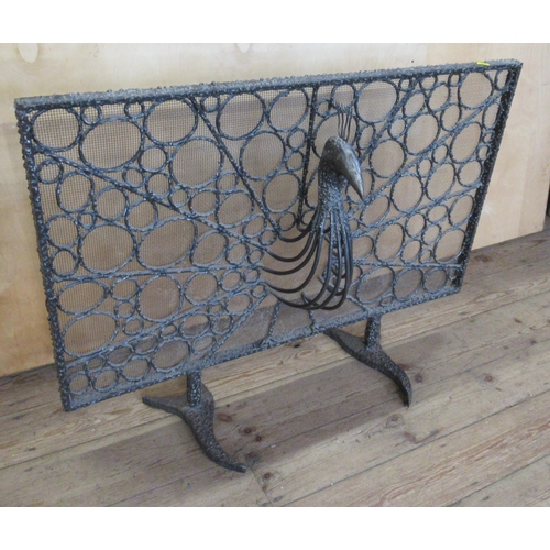 61 - A metal and wire fire spark guard, with peacock head decorations, height 28ins, width 39.5ins