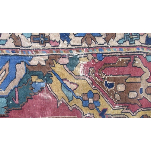 76B - A large Eastern design rug, the field decorated with stylised animals and flowers, with Made in Turk... 