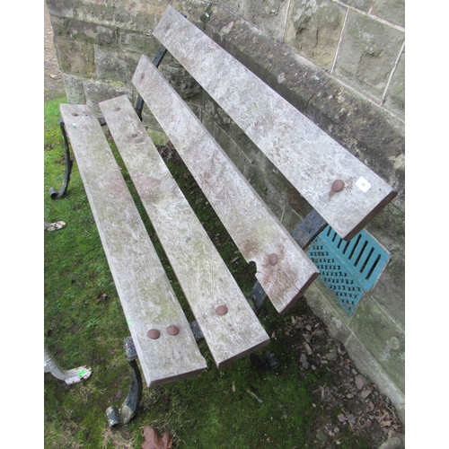 95 - A wrought iron and wooden bench together with a table