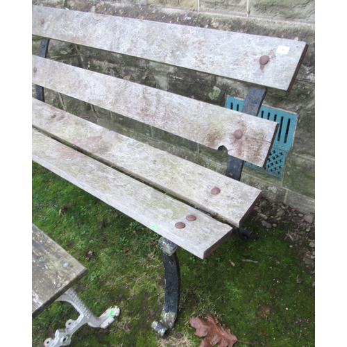 95 - A wrought iron and wooden bench together with a table